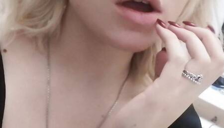 Evening home striptease in black clothes. Close-up