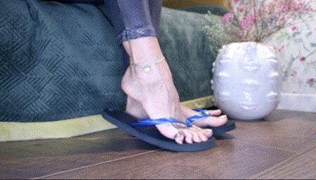 Black flip flops dangling and play AVI