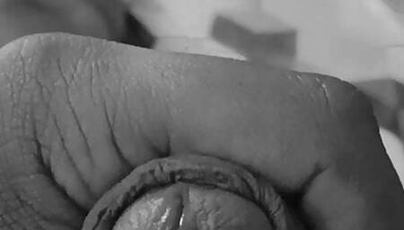 Playing with clean shaven cock and balls