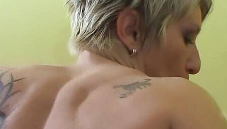 Tattooed German lady showing off her masturbation skills