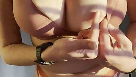 playing with her nipples in the sun