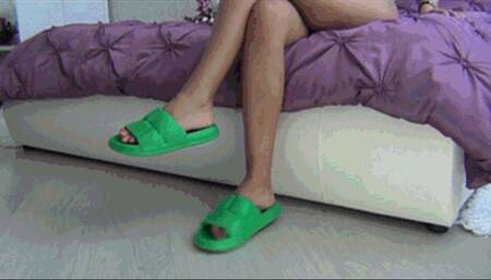 Dangling in green rubber flip flops c