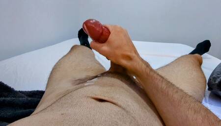 Laying down in bed while I jerk off to the beat