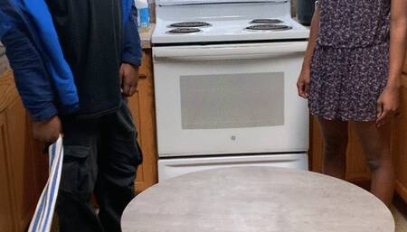 African girl gets a hard belt spanking laying on the kitchen table