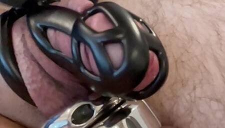 Teasing a slaves locked cock