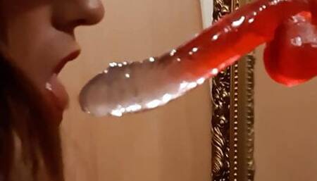Sissy schoolgirl sucking a dildo