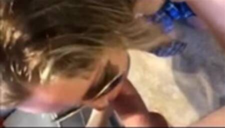 Blonde MILF in sunglasses deepthroats cock