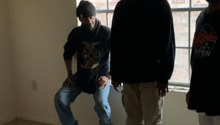 African guy gets a hard hand spanking while his legs are being held down