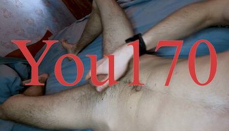 I masturbate my big cock on the bed, showing my ass