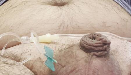 Inserting a large catheter into a small cock with big balls