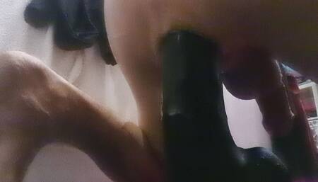 Stuffing my ass with a massive black dildo