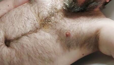 Some solo chastity watersports in the bath for this piss thirsty locked bear