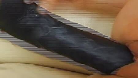Big titted German slut riding her thick black dildo with her shaved muff