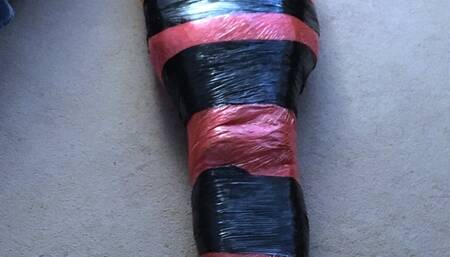 Mummification tight in pallet wrap escape challenge  mummified male bondage