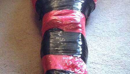 Mummified tight in pallet wrap escape challenge male bondage, mummification