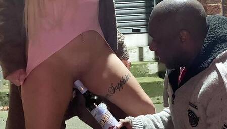 Being fucked with a bottle outdoors in public