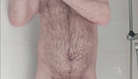 Chastity locked bear in the shower