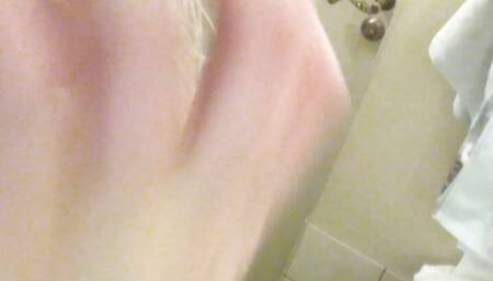 Nude gentle striptease in the bathroom. Close-up