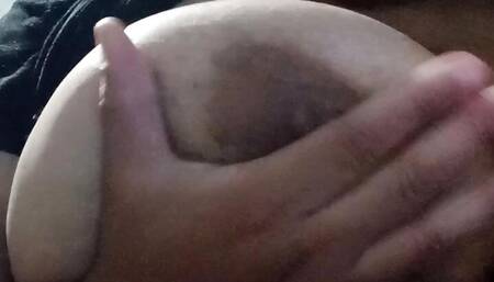 Playing with my tits with my new toy.