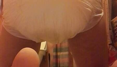 Boy messing his diaper