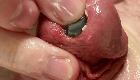 Close up of sounding a rubber bolt all the way down my big cock for the first time