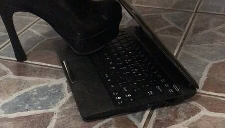 Metal tip heels destroy laptop