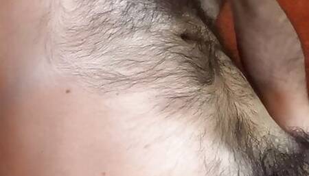 Lounging upside-down on the couch, masturbating to thick cum on my very hairy white belly then smearing it in the hairs
