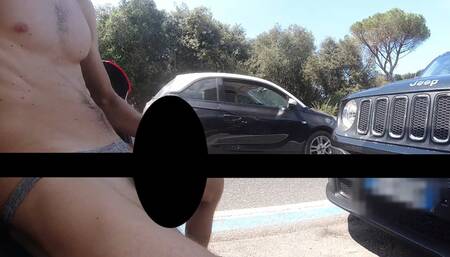 Cumshot in slowmotion in the street with passing cars