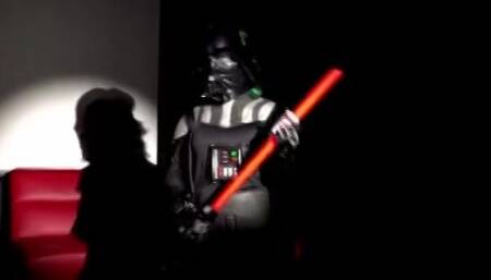 Linda " darth vader " plays with her Light Saber