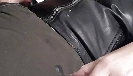 Gimp cums on leather jacket
