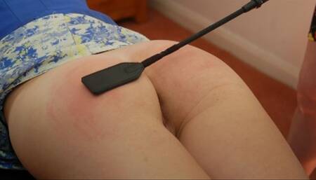 Will a riding crop across her bare bottom stop Lucy from boasting?