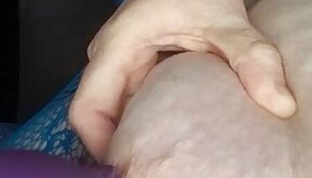 TheLady plays with a sucking vibrator on her nipple