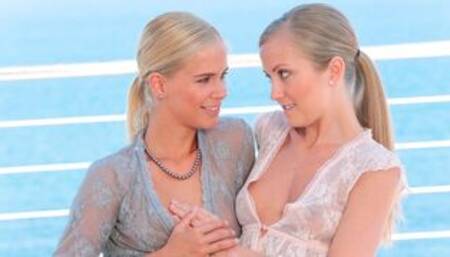 Two blondes Tracy Gold and Sicilia are fucking under the baking sun