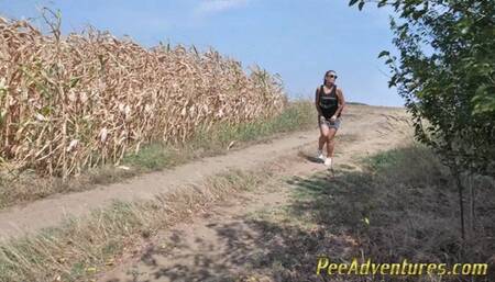 Pee standing on a dirt road in the countryside - Wet her panties outdoor and smoke until they dry