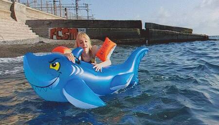 Fucking an inflatable shark on the waves of the sea near a deserted beach!!!