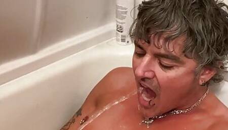 Taking a golden shower and drinking my piss in the bathtub