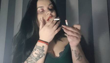 i will challenge she smokes 2 cigarettes for 10 mimes with garish makeup and lots of lipstick