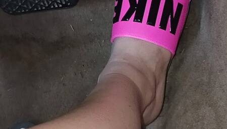 Driving the Benz in pink Nike slides