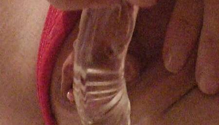 Fucking herself with a glass dildo until her pussy cums hard!