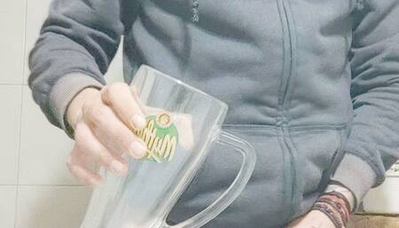 A HUGE GLASS FULL WITH PISS ITS HUUUUUUGE