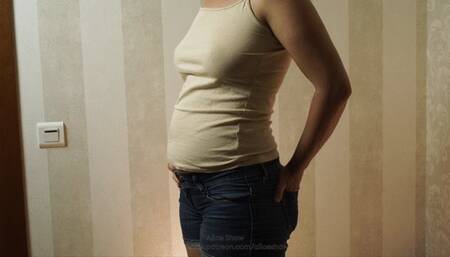 Bloated belly in shorts