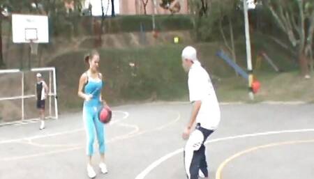 Paris Milan plays basketball outdoors