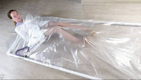 Nurse in a polyethylene vacuum bed