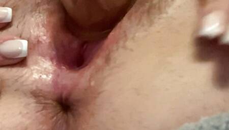 A hairy bitch stretches her pussy and inflates her ass with a vacuum