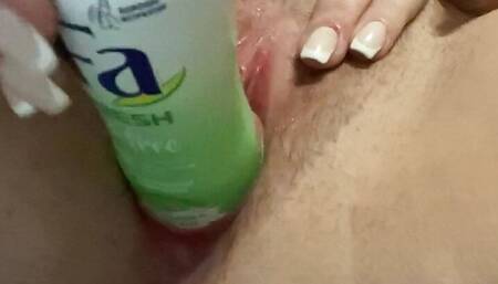 Horny bitch fucks herself with a bottle