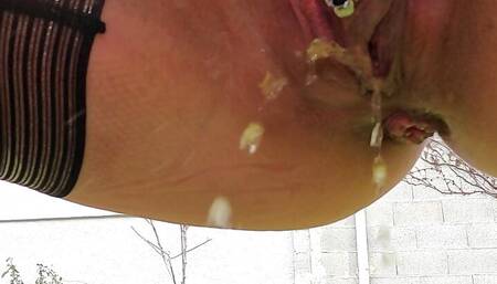 MILF in stockings and heels with a leather skirt pee squatting outside close up on her pierced cunt