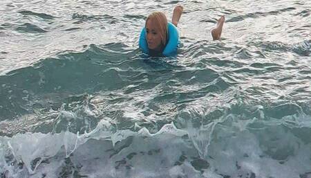 Alla swims in the sea and wears a blue inflatable vest!!!