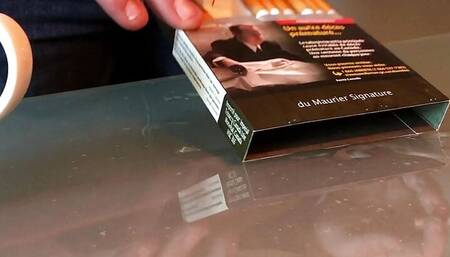 Pissing on a pack of cigarettes