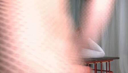 Suspension in catsuit with red belts