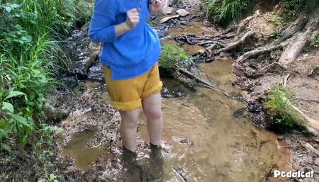 Barefoot in the mud, heels getting stuck in the mud, puddle splashing